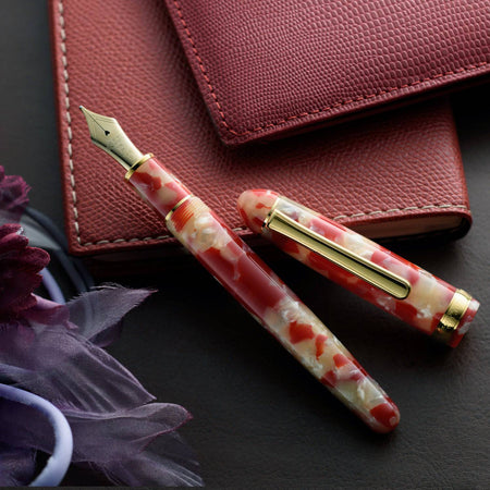 Platinum #3776 Century fountain pen with koi celluloid barrel and fine nib, showcasing elegant Japanese-inspired design.