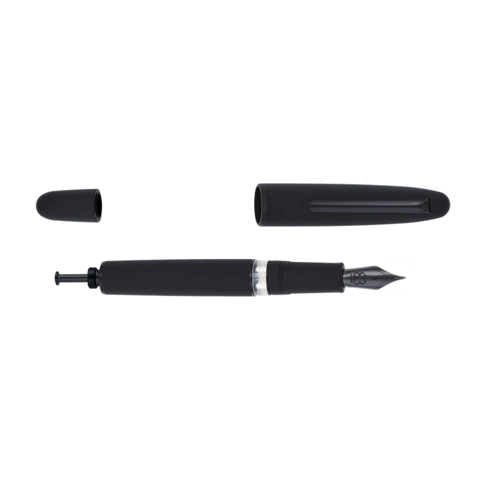 Esterbrook Estie push button fountain pen with black resin body and gold accents, showcasing a sleek and elegant writing instrument.