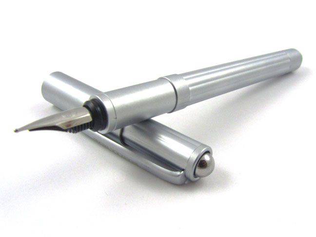 Rebecca Moss Turbo Fountain Pen with black ink barrel and silver accents, showcasing its sleek design and fine writing tip.