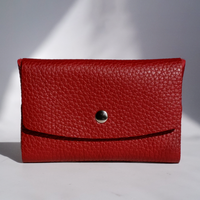 Red leather Swatch Book Card Holder by Papier Plume, with multiple card slots and a sleek compact design.
