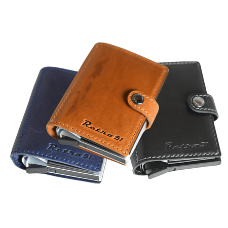 Retro 51 Modern Traveler leather wallet with ballpoint pen in black stealth, featuring multiple card slots and sleek design.