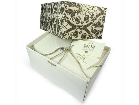 Rossi AD 1404 Charta Italica envelopes, cream-colored paper envelopes with a smooth finish, featuring a classic rectangular shape.