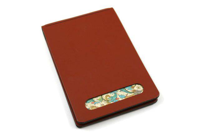 San Lorenzo regenerated leather memo pad cover in vibrant orange, showcasing smooth texture and sleek design.
