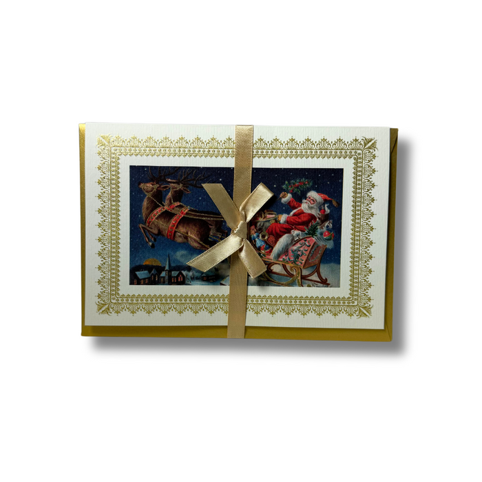 Rossi Christmas Card featuring a festive Santa's sleigh with reindeer and holiday decorations on a snowy background.