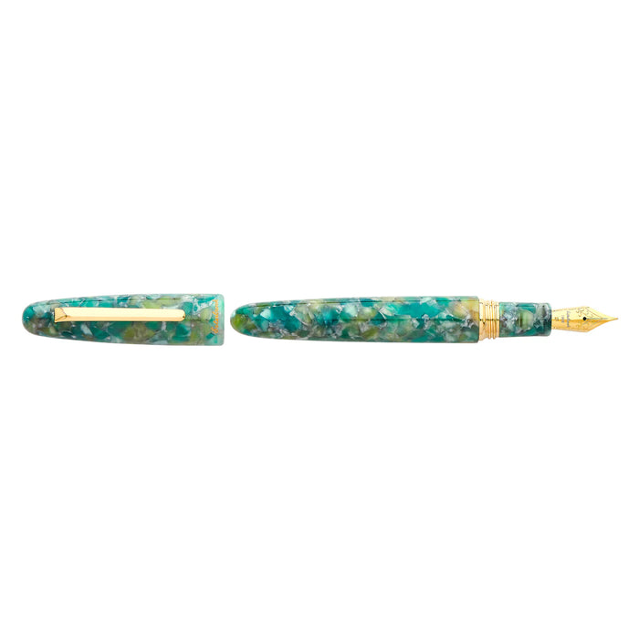 Esterbrook Estie fountain pen with sea glass-colored body and gold fittings, showcasing a luxurious writing instrument.