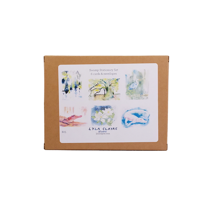 Lyla Clayre Swamp Stationery Set with note cards featuring swamp-themed illustrations, in earthy green and brown tones.