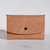 Swatch Book Card Holder by Papier Plume made of regenerated leather in tan, showing multiple card slots and a sleek design.