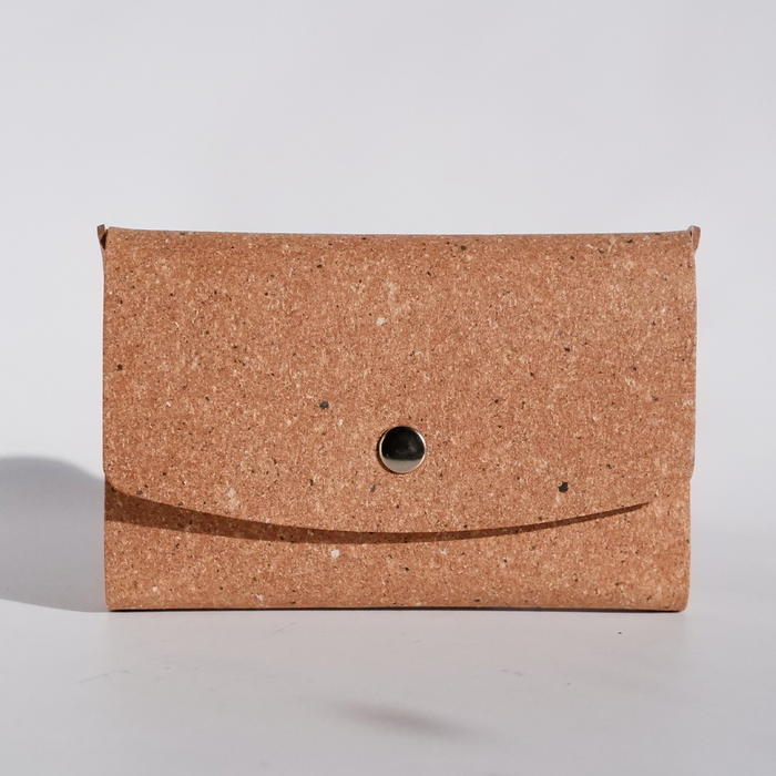 Swatch Book Card Holder by Papier Plume made of regenerated leather in tan, showing multiple card slots and a sleek design.