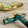 Esterbrook x BUNGUBOX Kingfisher Estie fountain pen with blue and gold accents, showcasing a limited edition design.