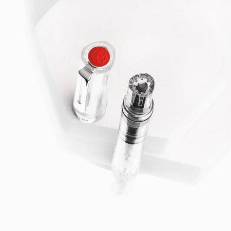 Twsbi Eco Clear Fountain Pen with extra-fine steel nib, transparent body showing internal ink mechanism, sleek and modern design.