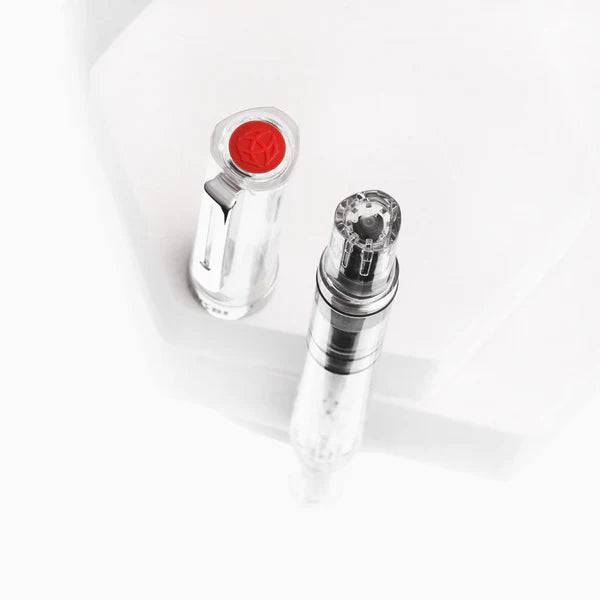Twsbi Eco Clear Fountain Pen with extra-fine steel nib, transparent body showing internal ink mechanism, sleek and modern design.
