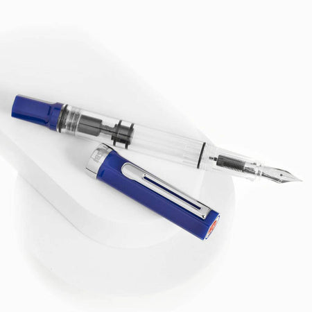 Twsbi Eco Dark Sapphire fountain pen with an extra-fine steel nib, showcasing a sleek dark blue barrel and modern design.