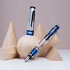 Twsbi Diamond 580 ALR fountain pen in navy blue with gold accents, featuring an extra-fine nib and smooth ink flow.