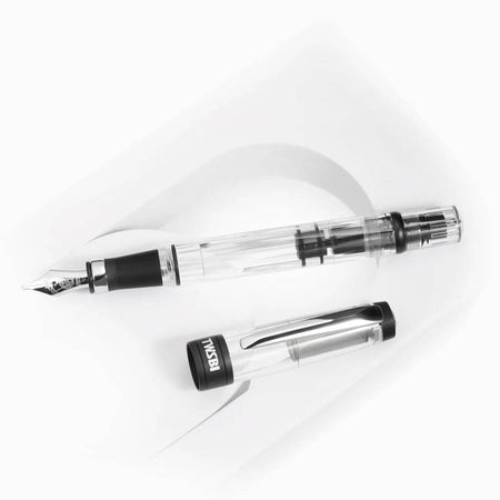 Twsbi Diamond 580AL R black fountain pen with silver accents and fine nib, showcasing sleek design and polished finish.