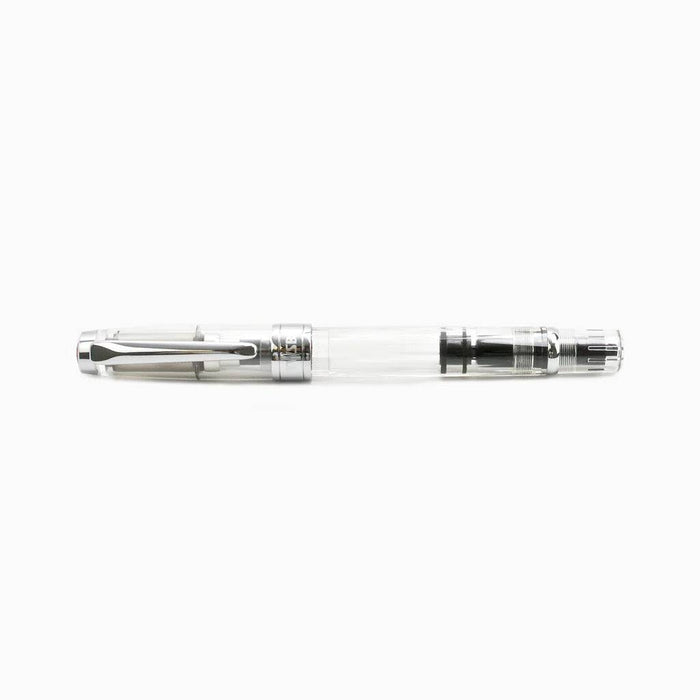 Twsbi Diamond 580 Clear fountain pen with transparent body and gold accents, featuring an extra-fine nib.