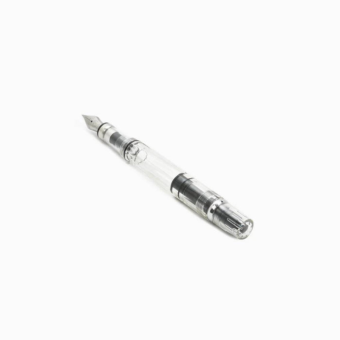 Twsbi Diamond 580 Clear fountain pen with transparent body and gold accents, showcasing its sleek design and fine nib.