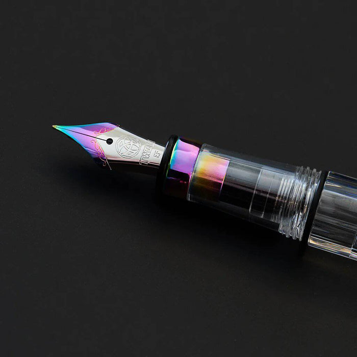 Twsbi Diamond 580 IRIS fountain pen with gold accents and transparent body, showcasing its elegant design and fine nib.