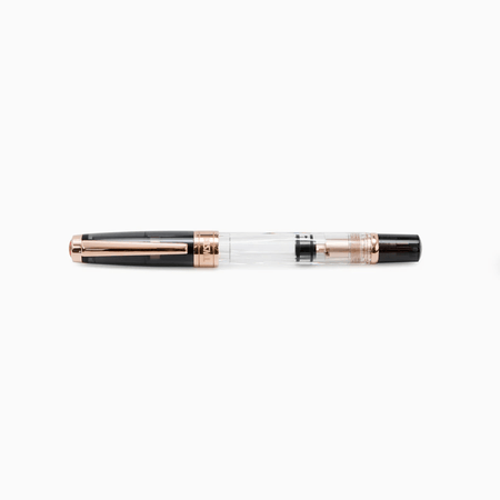 Twsbi Diamond 580 fountain pen with smoke rose gold finish, featuring an extra-fine nib and elegant design.