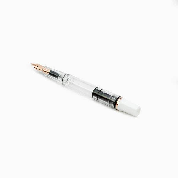 Twsbi Diamond 580 White Rose Gold II fountain pen with white body and rose gold accents, showcasing a sleek design and fine nib.
