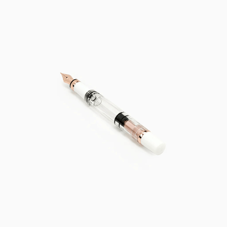 Twsbi Diamond 580 White Rose Gold II fountain pen with gold accents and white resin body, close-up of the elegant writing instrument.