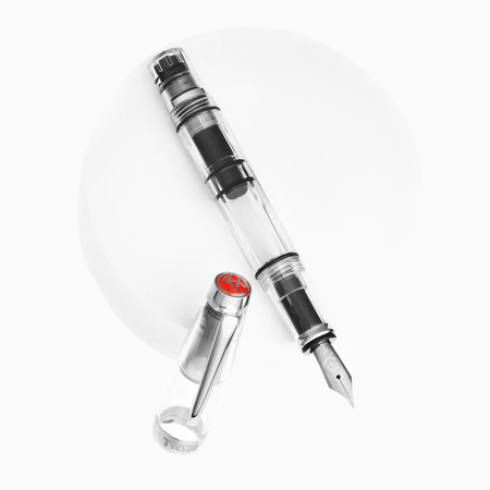 Twsbi Diamond Mini Clear fountain pen with transparent body and fine nib, showcasing its elegant design and compact size.