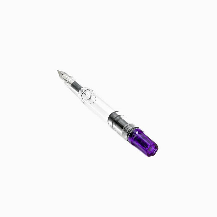 Twsbi Eco transparent purple fountain pen with fine nib, showcasing clear barrel and purple accents.