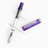 Twsbi Eco transparent purple fountain pen with silver accents and an extra-fine nib, showcasing its sleek design and clear barrel.
