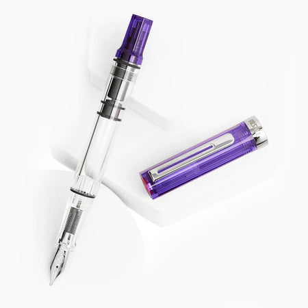 Twsbi Eco transparent purple fountain pen with silver accents and an extra-fine nib, showcasing its sleek design and clear barrel.