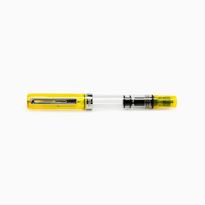 Twsbi Eco transparent yellow fountain pen with fine nib, showcasing clear body and vibrant yellow ink reservoir.