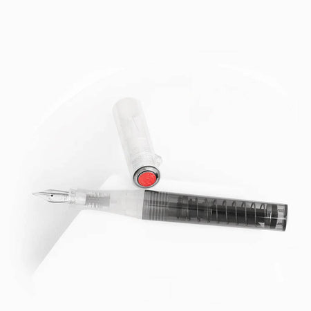 Twsbi Go Smoke fountain pen with extra-fine nib, black and gray smoky translucent plastic body, and metal clip.