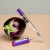 Twsbi Eco-T Eggplant Purple fountain pen with smooth purple barrel and gold accents, showcasing the elegant writing instrument.