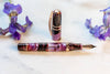 Visconti Homo Sapiens Iris Garden fountain pen with a sleek design and fine nib, showcasing elegant craftsmanship and vibrant detailing.
