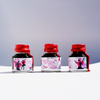 Papier Plume New Orleans Collection fountain pen ink bottle with colorful design and ink inside, suitable for writing and calligraphy.