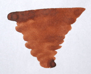 Bottle of Diamine warm brown fountain pen ink showing the ink's rich brown color in a clear glass container