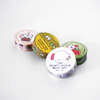 Colorful Papier Plume washi tape roll with floral and geometric patterns, perfect for decorating craft projects and journals.