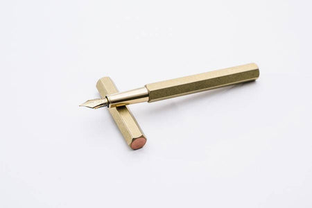 Y Studio Revolve fountain pen in black with fine nib, featuring sleek design and smooth writing surface.