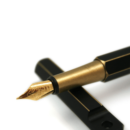 Y Studio Brassing portable fountain pen with fine nib, sleek design, and metallic finish for writing elegance.