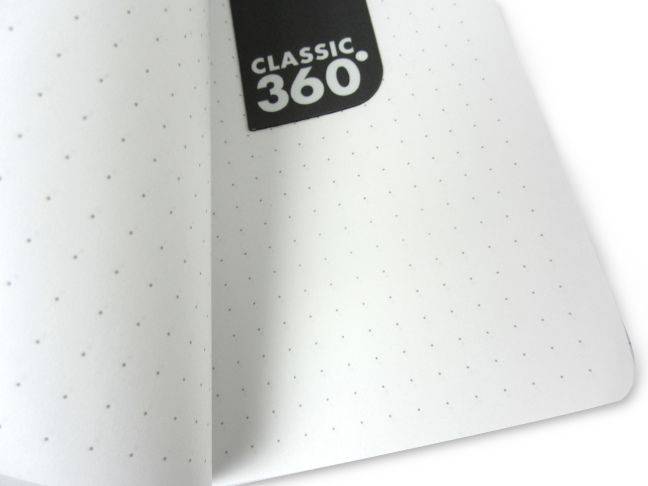 Zequenz Classic 360 Air journal in black with rounded edges and smooth cover, open to show lined pages inside.